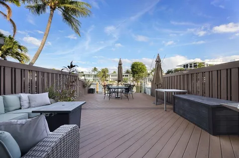 a view of a balcony with wooden floor