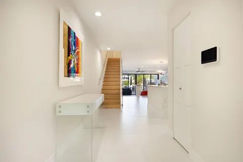 a view of an entryway with wooden floor