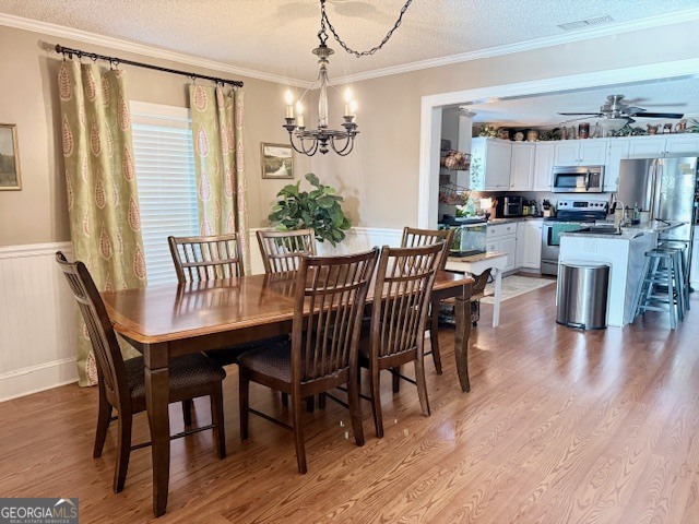 968 St Mathews Church Road Metter, GA 30439 - Photo 13 of 35 a dining room with furniture wooden floor and a chandelier