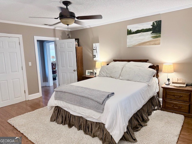 968 St Mathews Church Road Metter, GA 30439 - Photo 23 of 35 a bedroom with a bed and wooden floor