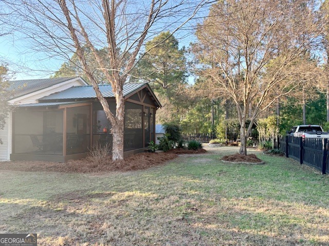 968 St Mathews Church Road Metter, GA 30439 - Photo 31 of 35 a view of a yard with a house and a tree