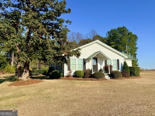 968 St Mathews Church Road Metter, GA 30439 - Photo 34 of 35 a front view of a house with a yard