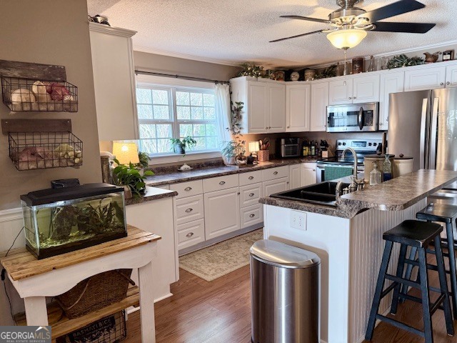 968 St Mathews Church Road Metter, GA 30439 - Photo 4 of 35 a kitchen with a stove a sink and a refrigerator