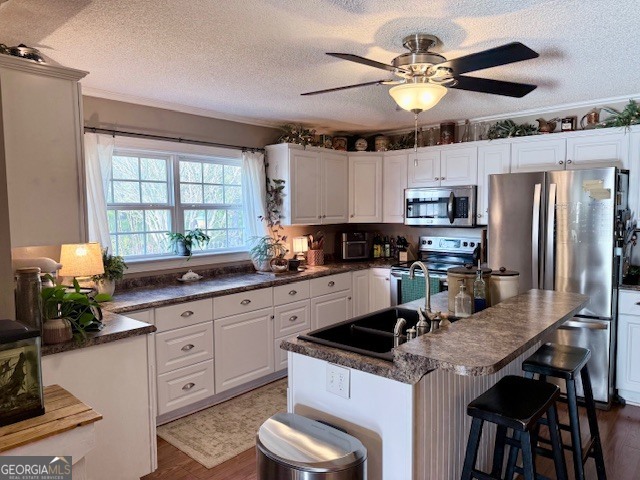 968 St Mathews Church Road Metter, GA 30439 - Photo 6 of 35 a kitchen with stainless steel appliances granite countertop a sink a stove and a refrigerator