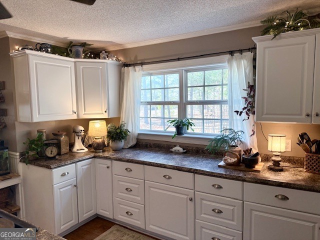 968 St Mathews Church Road Metter, GA 30439 - Photo 8 of 35 a kitchen with granite countertop white cabinets and white stainless steel appliances