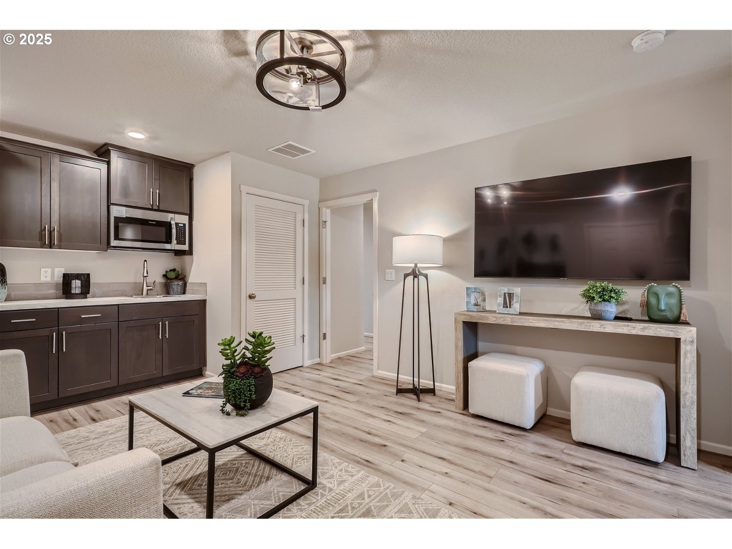 1011 Clemson Street Gervais, OR 97026 - Photo 4 of 16 a living room with furniture and a flat screen tv