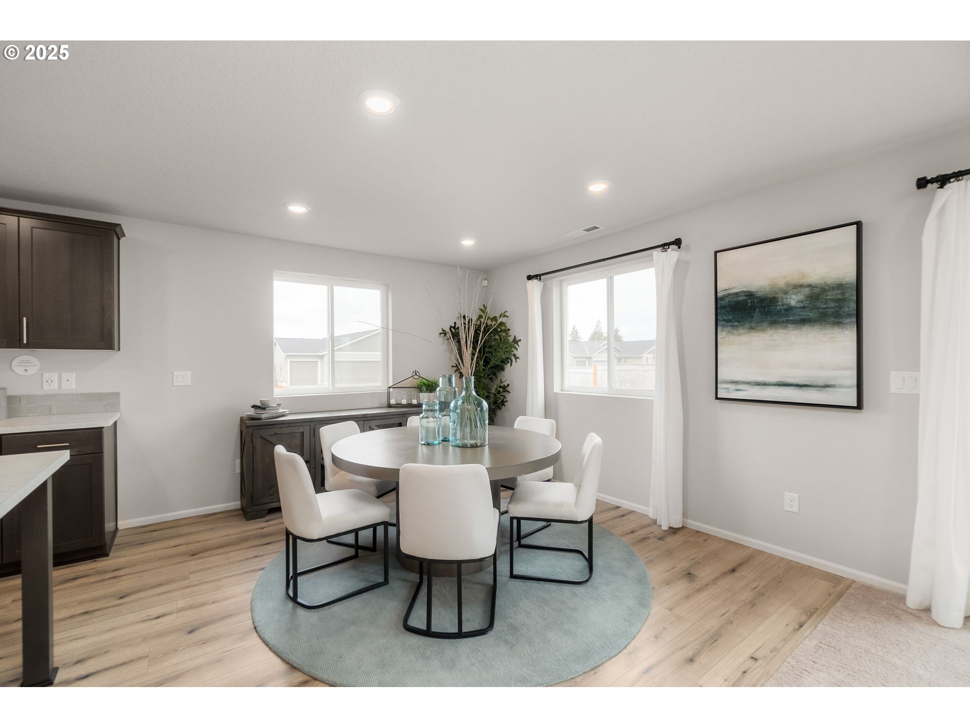 1011 Clemson Street Gervais, OR 97026 - Photo 7 of 16 a view of a dining room with furniture window and wooden floor