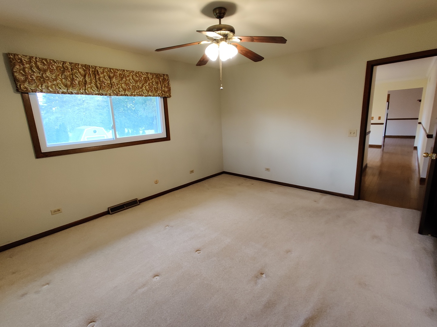 8N601 Stevens Road Elgin, IL 60124 - Photo 19 of 34 a view of a room with a ceiling fan and a window