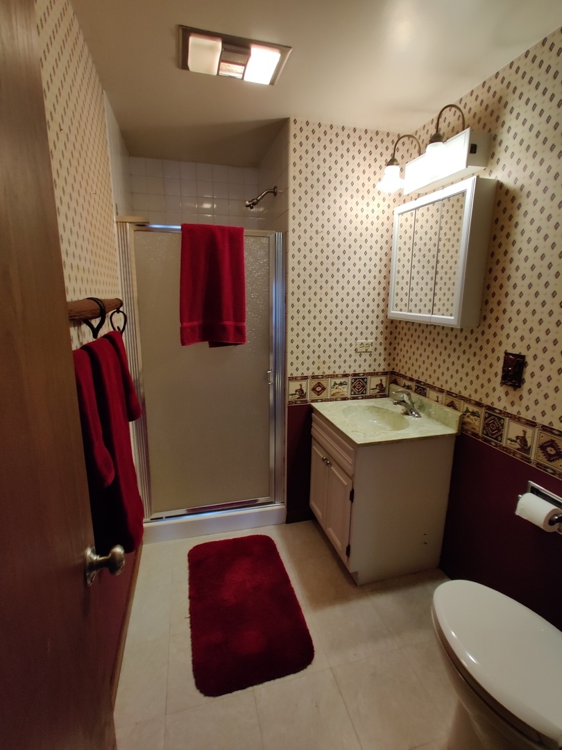 8N601 Stevens Road Elgin, IL 60124 - Photo 27 of 34 a bathroom with a granite countertop sink mirror vanity and toilet