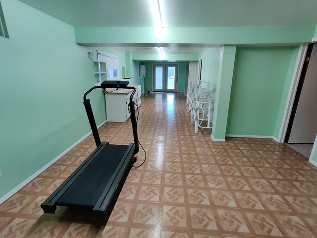 a view of a hallway with chairs