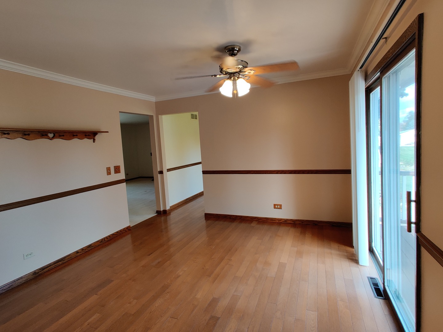 8N601 Stevens Road Elgin, IL 60124 - Photo 5 of 34 a view of a room with wooden floor and a ceiling fan