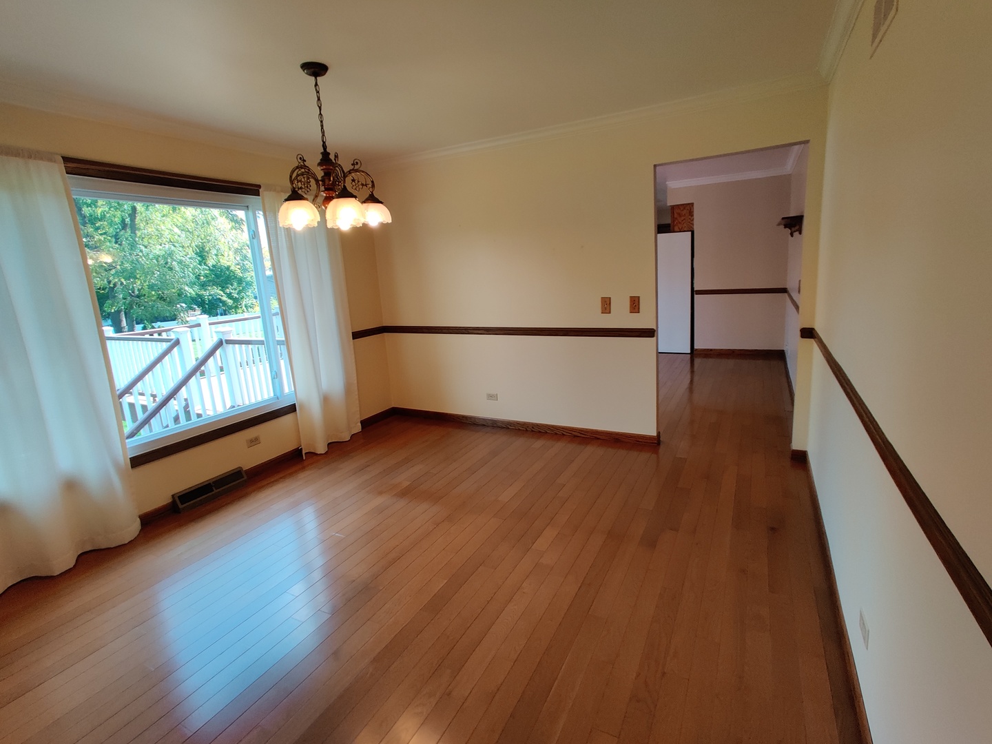 8N601 Stevens Road Elgin, IL 60124 - Photo 9 of 34 wooden floor in an empty room with a window