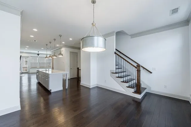 a view of an entryway with wooden floor