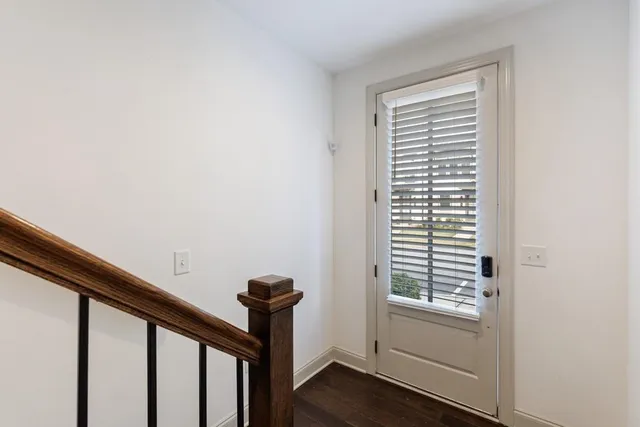 a view of a hallway with a window