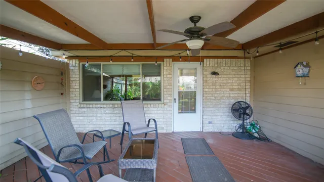 a view of a porch with seating space