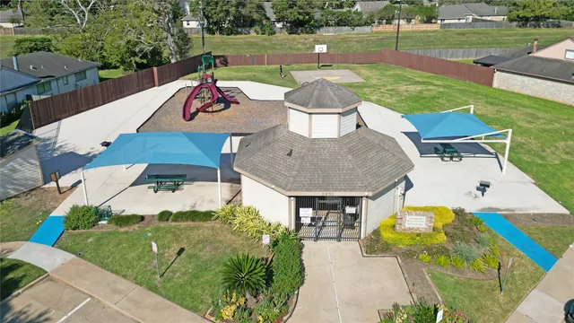 an outdoor space with furniture and garden