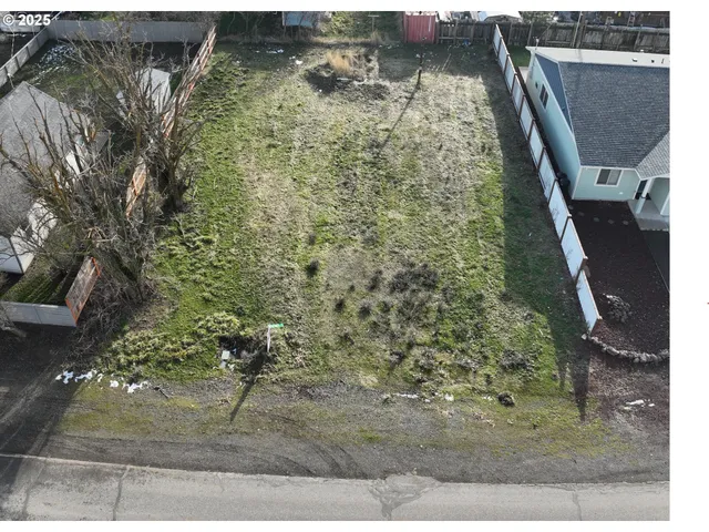 a aerial view of a house with a yard