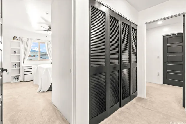 a view of washer and dryer with kitchen in the background