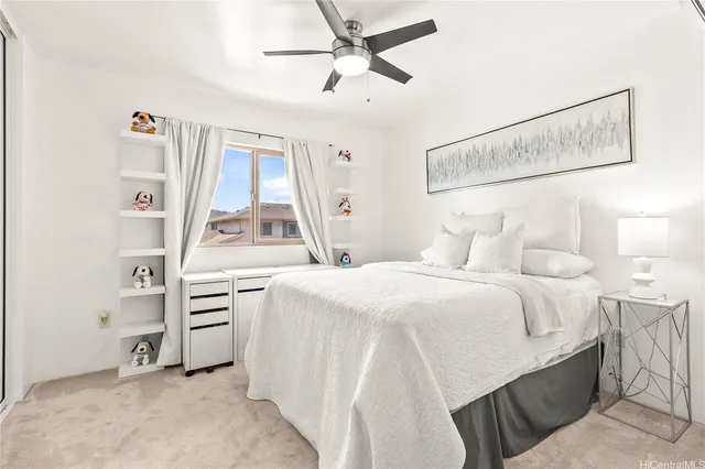 a room with a bed and a large window