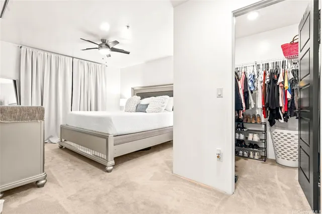 a large white bed in a white room