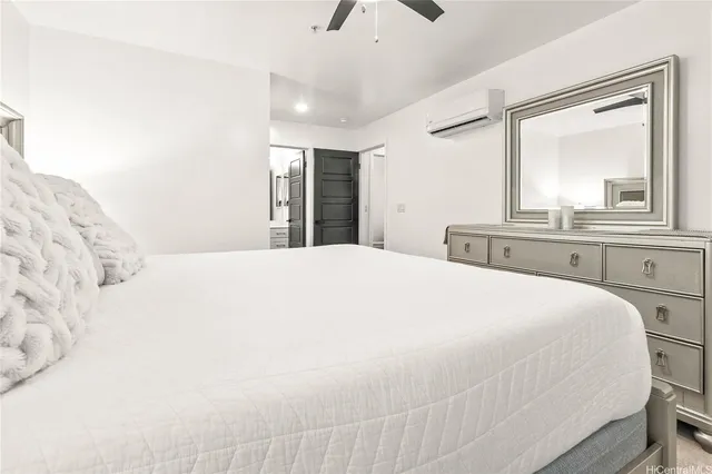 a large white bed in a white room