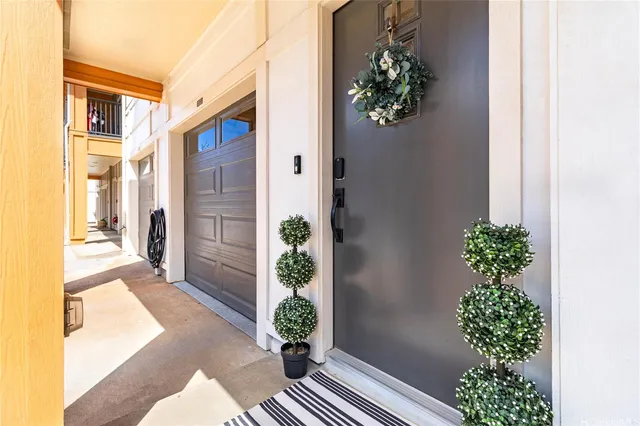 a view of a room with wooden floor and windows