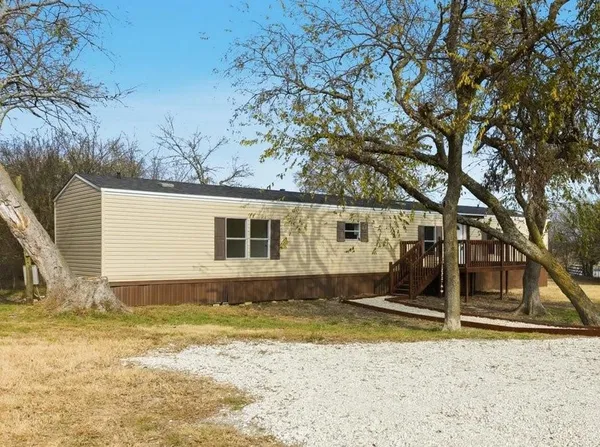 a view of a backyard of the house