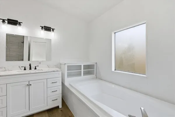 a bathroom with a sink and a bathtub