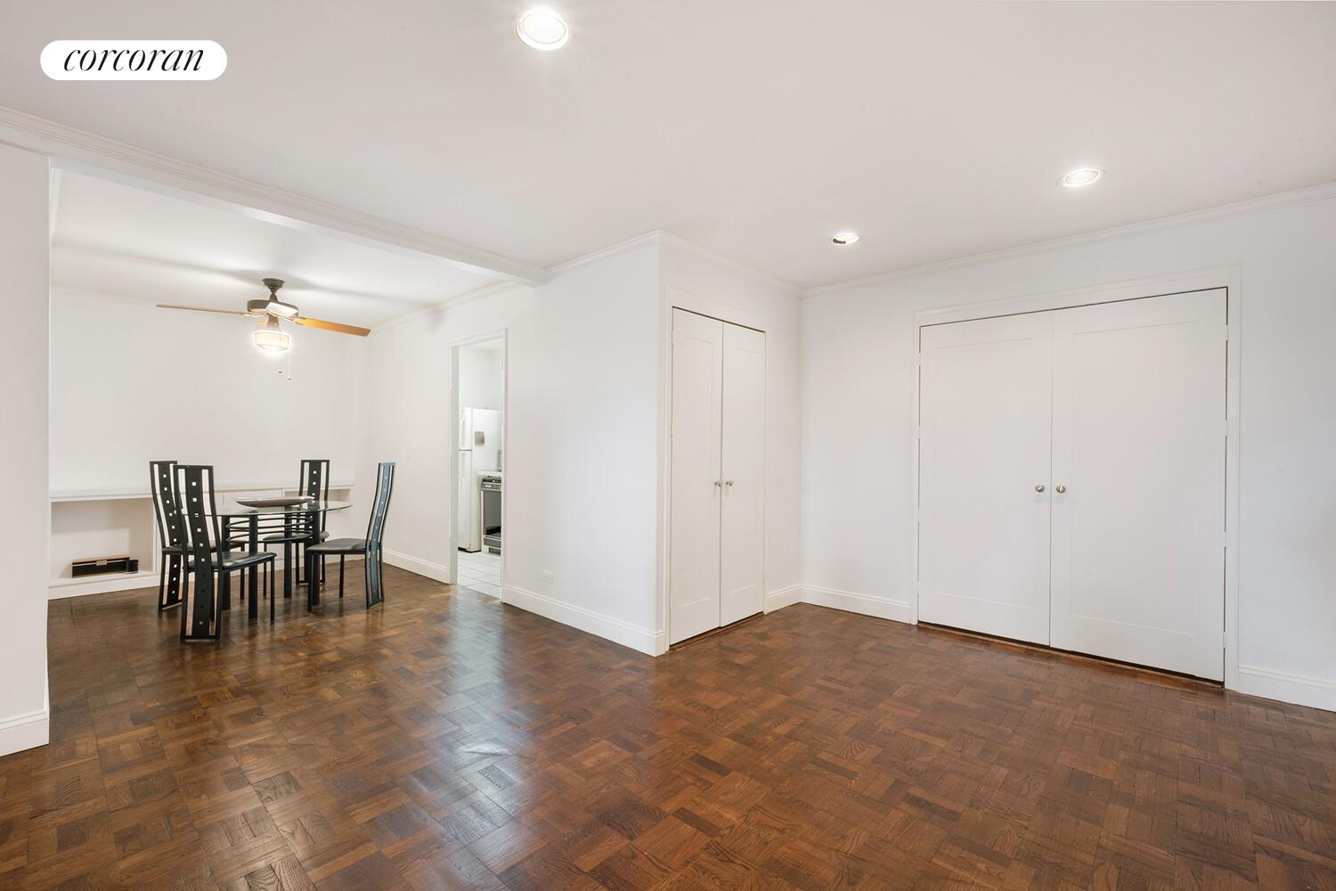 315 East 70th Street, Unit 4D Manhattan, NY 10021 - Photo 3 of 6 a view of dining room with furniture and wooden floor