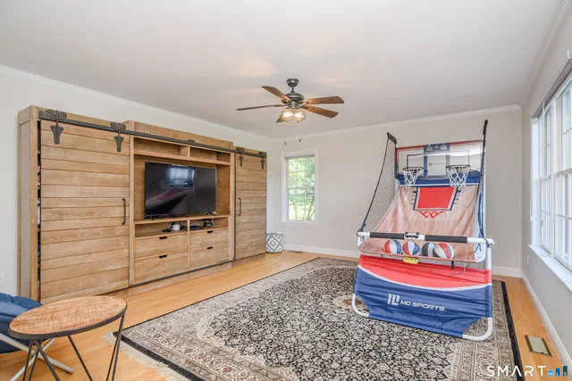 a bathroom with a sink vanity mirror and toilet
