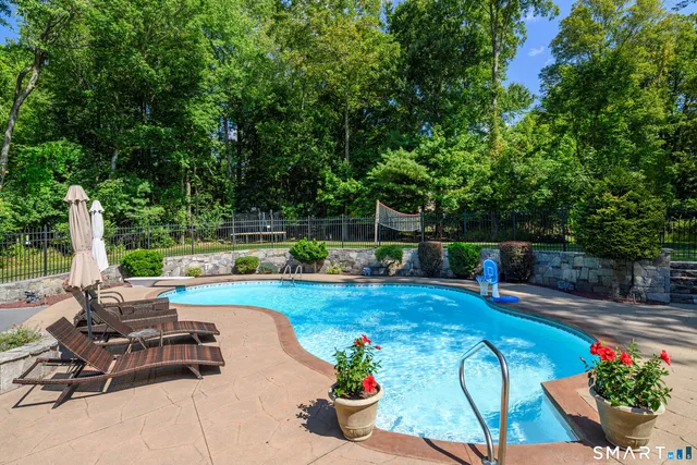 a view of a backyard with sitting area