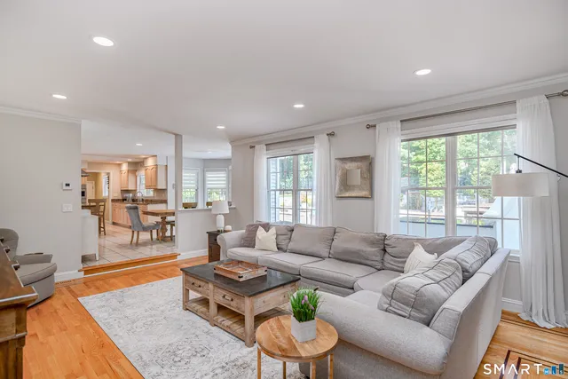 a view of entryway livingroom and hall