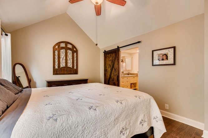 957 Thompson Road Pegram, TN 37143 - Photo 15 of 27 Valueted Ceilings and New Barn Door are some Details that makes this Master Bedroom Special
