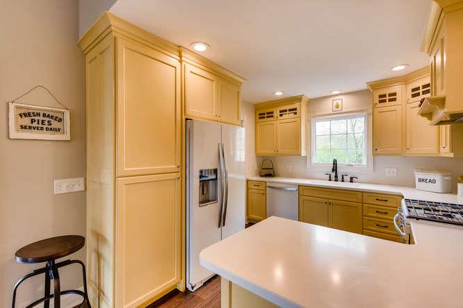 957 Thompson Road Pegram, TN 37143 - Photo 9 of 27 So much light to cook with! Plenty of Storage with Cabinets that go all the way up to the Ceiling.