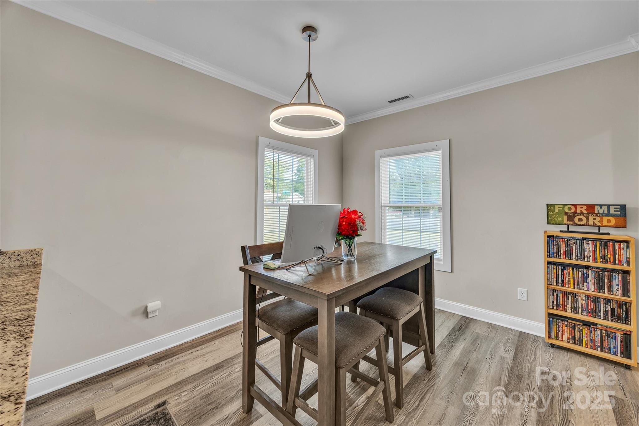 2510 Snow Creek Road Northeast Hickory, NC 28601 - Photo 11 of 45 a view of a dining room with furniture and wooden floor