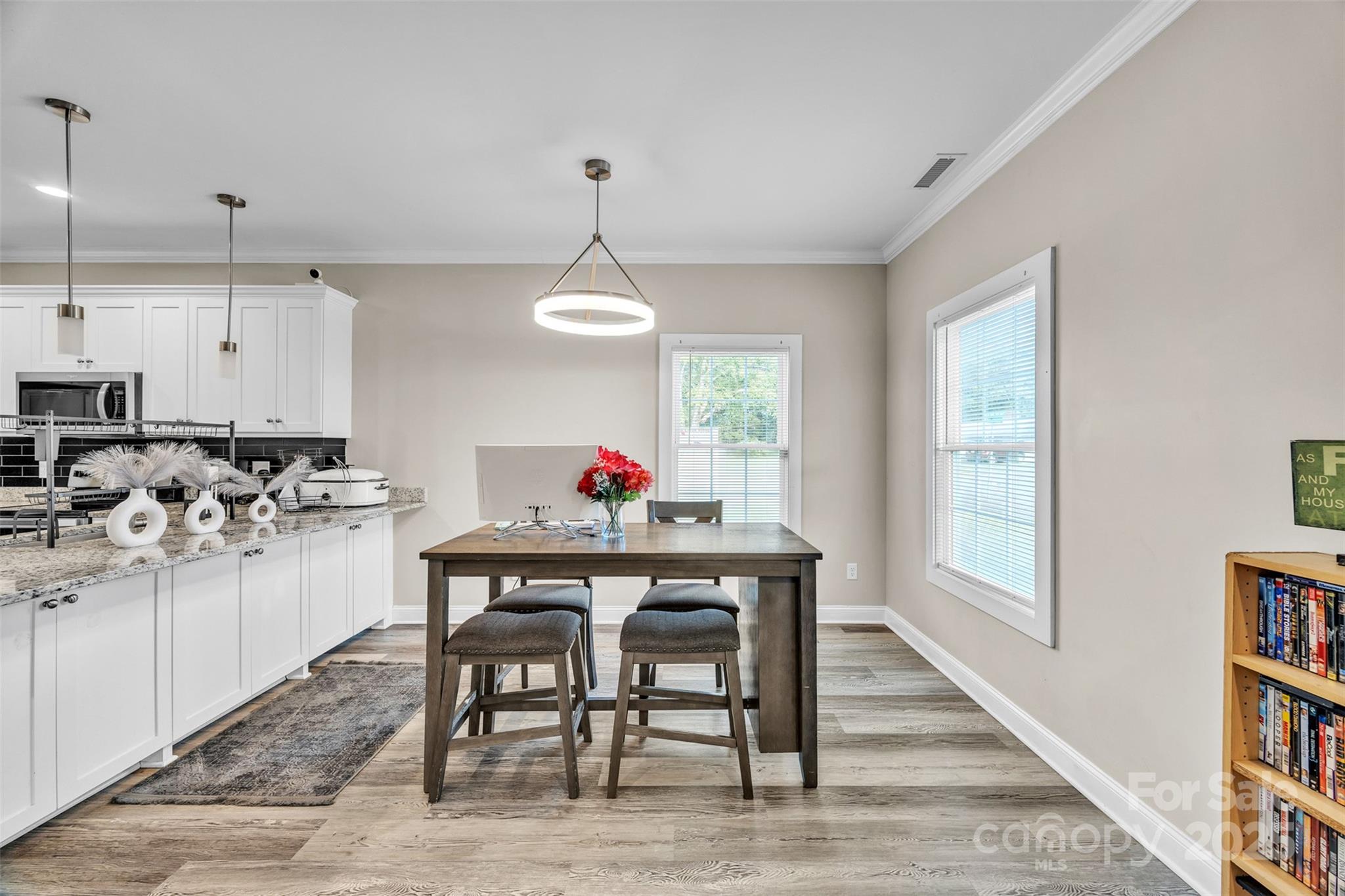 2510 Snow Creek Road Northeast Hickory, NC 28601 - Photo 12 of 45 a view of a dining room with furniture and a book shelf