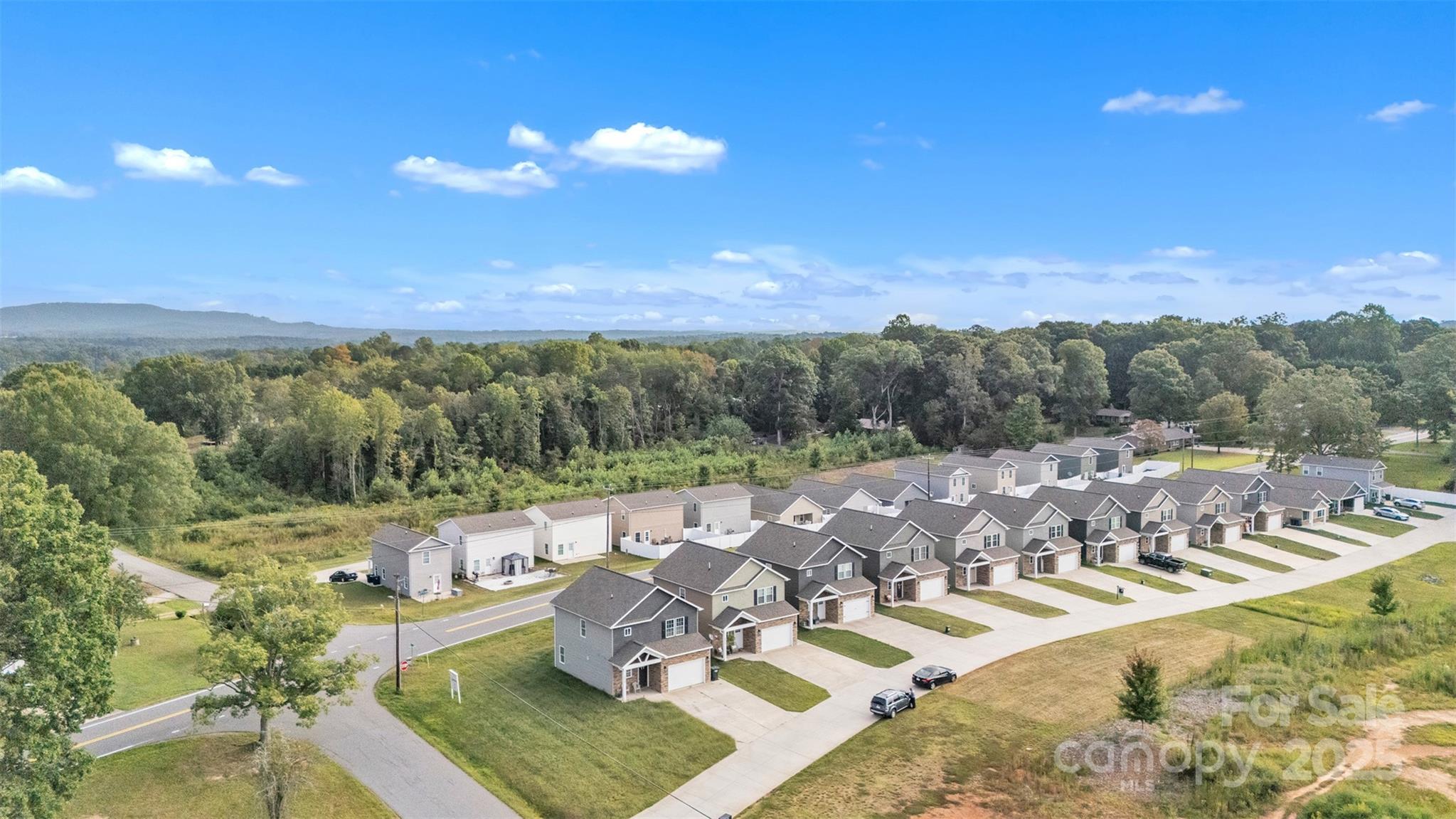 2510 Snow Creek Road Northeast Hickory, NC 28601 - Photo 2 of 45 a view of a balcony with couches and wooden floor