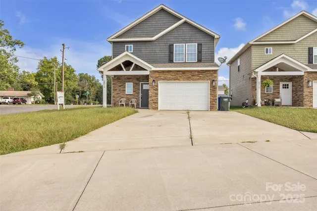 a front view of a house with yard