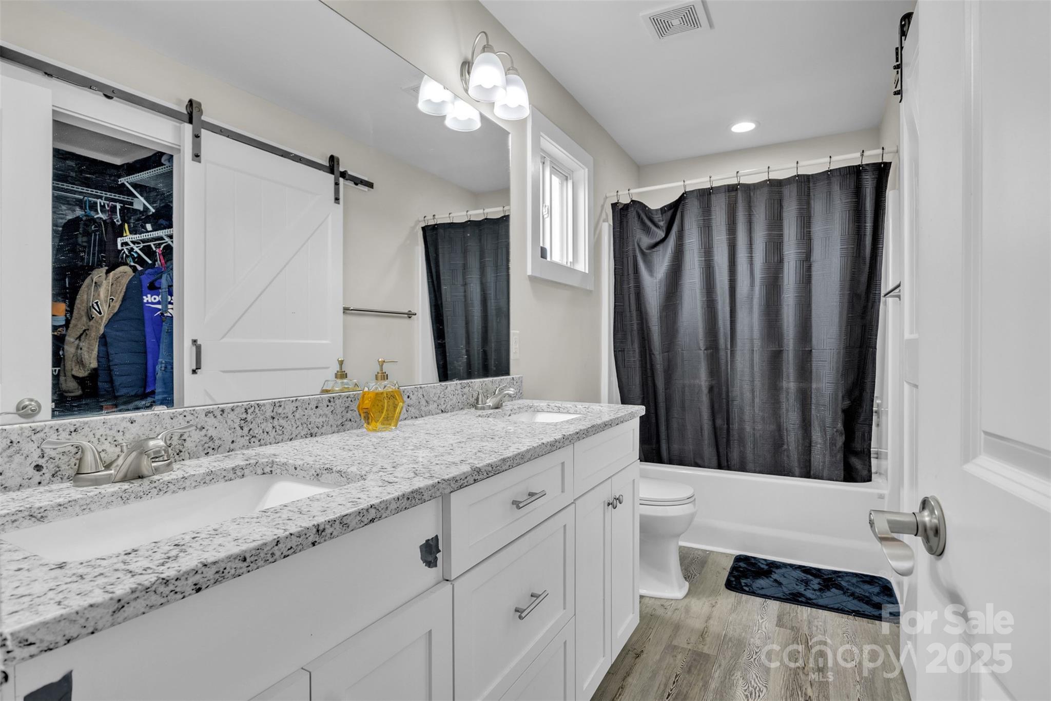 2510 Snow Creek Road Northeast Hickory, NC 28601 - Photo 31 of 45 a bathroom with a granite countertop sink and a mirror