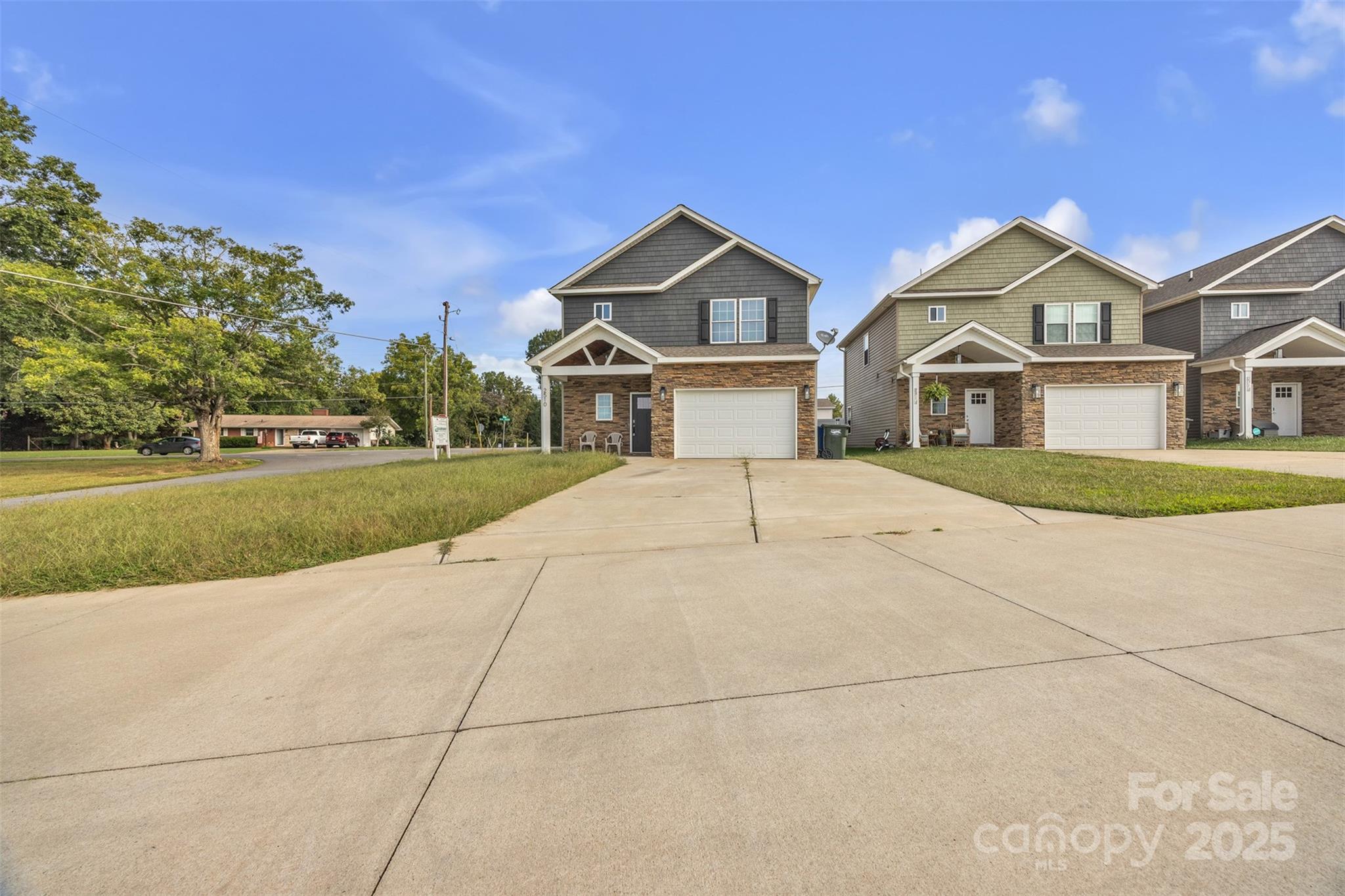 2510 Snow Creek Road Northeast Hickory, NC 28601 - Photo 37 of 45 a front view of a house with a yard and garage