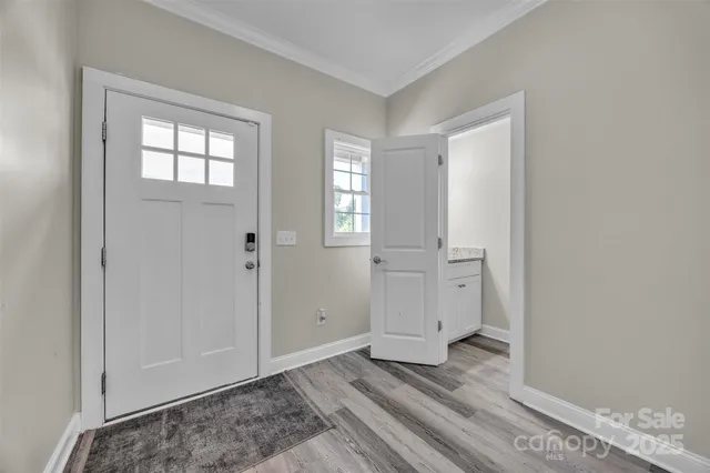 wooden floor with white walls