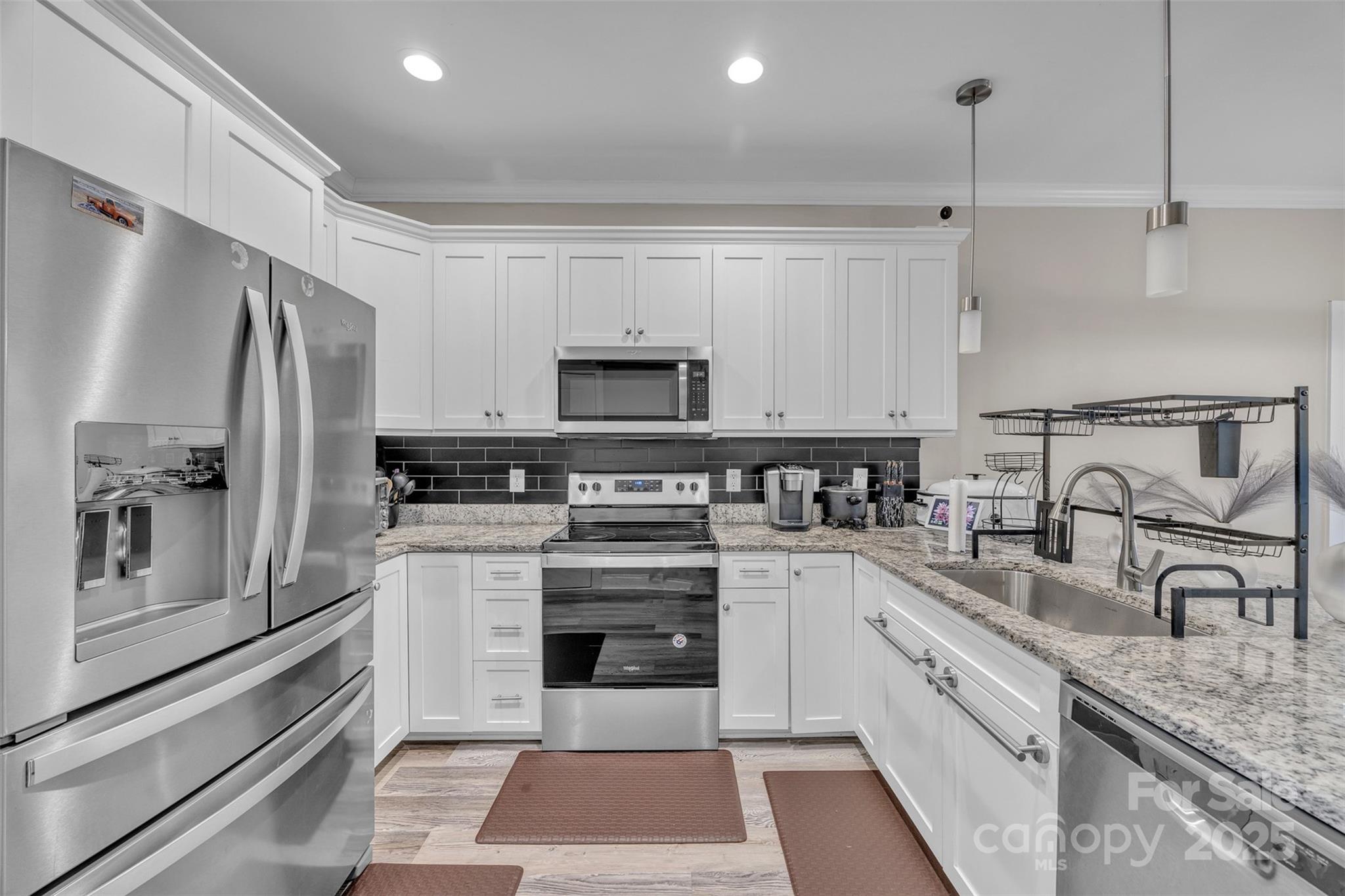 2510 Snow Creek Road Northeast Hickory, NC 28601 - Photo 9 of 45 a kitchen with a sink stove and refrigerator
