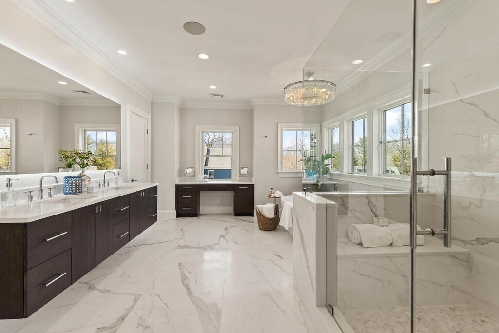8 Hayes Avenue Lexington, MA 02420 - Photo 16 of 24 a large bathroom with a double vanity sink a mirror and a shower
