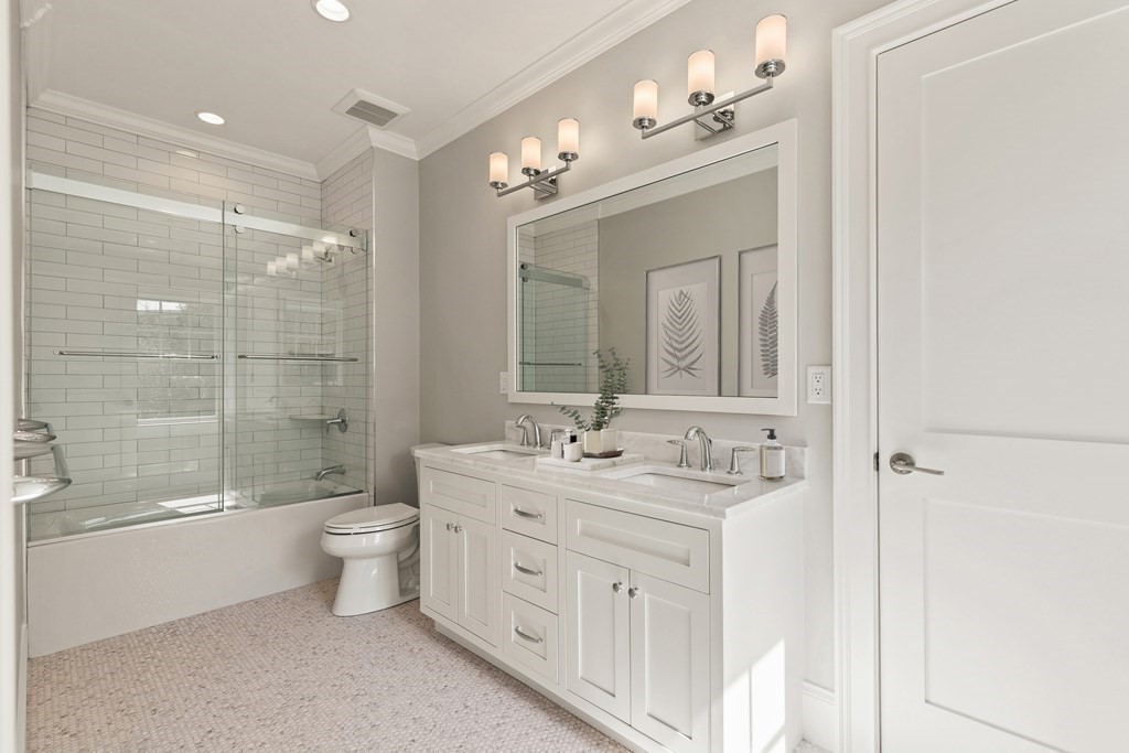 8 Hayes Avenue Lexington, MA 02420 - Photo 18 of 24 a bathroom with a double vanity sink mirror double and bathtub