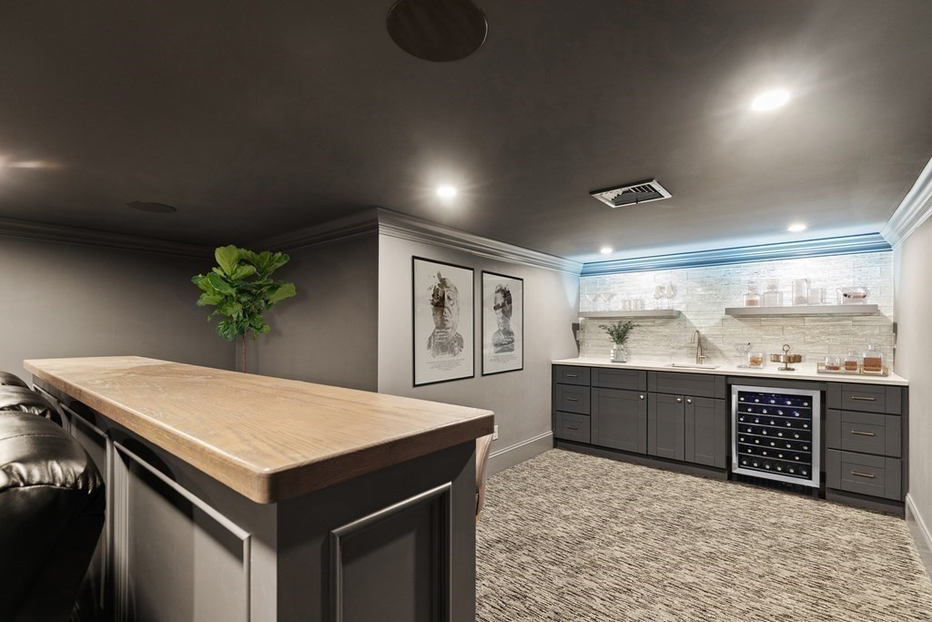 8 Hayes Avenue Lexington, MA 02420 - Photo 20 of 24 a kitchen with kitchen island a sink appliances and a counter top space