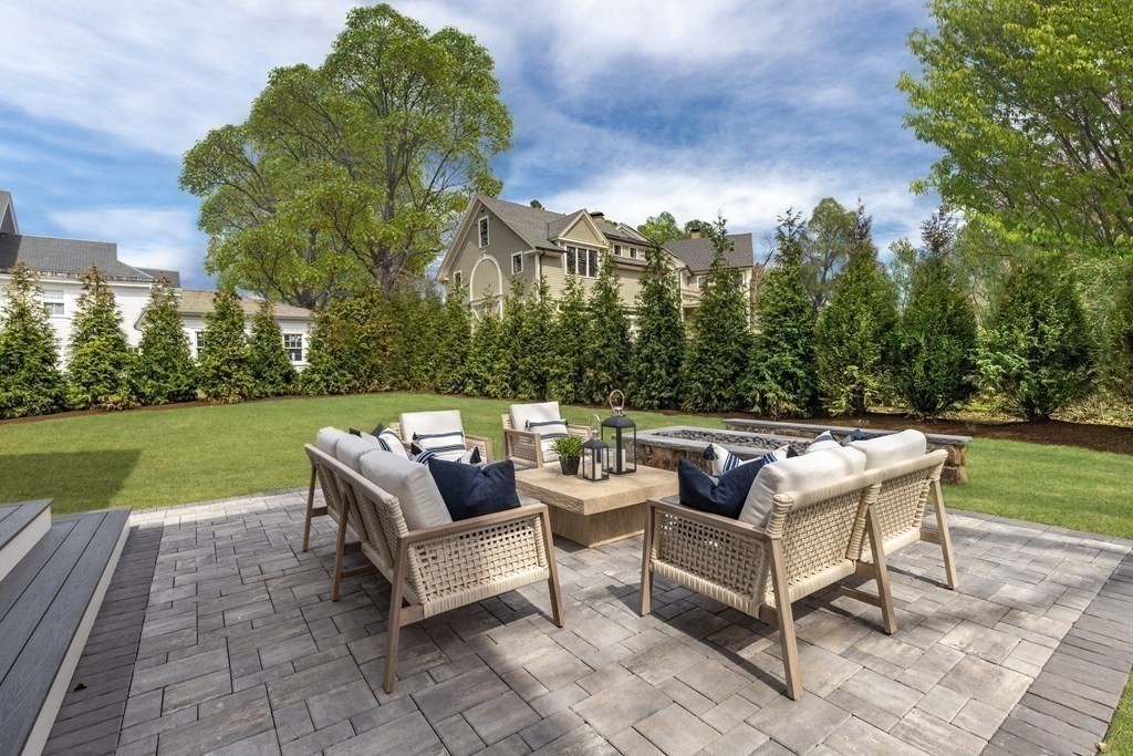 8 Hayes Avenue Lexington, MA 02420 - Photo 22 of 24 a view of a patio with couches and a fire pit