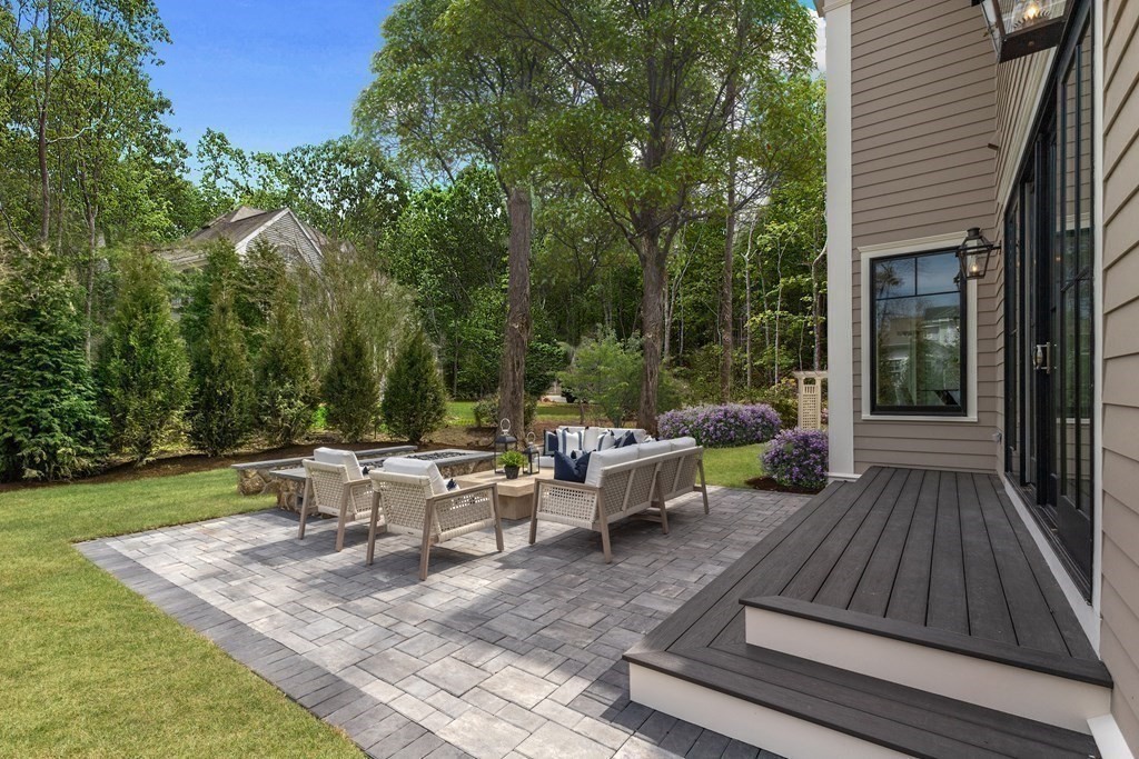 8 Hayes Avenue Lexington, MA 02420 - Photo 24 of 24 a view of a patio with couches table and chairs and potted plants
