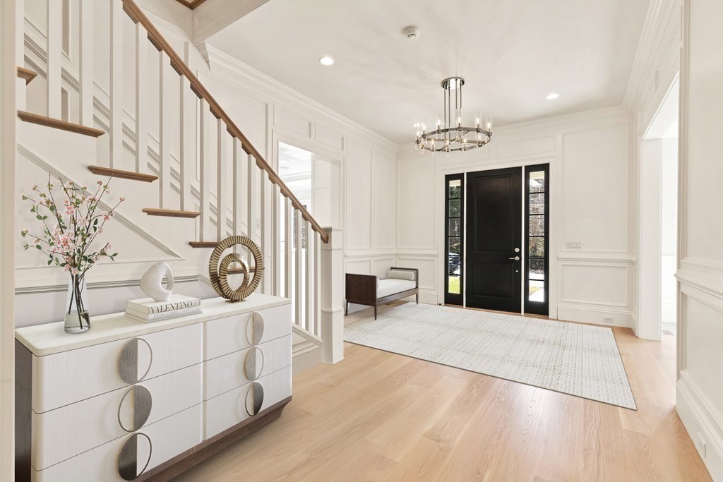8 Hayes Avenue Lexington, MA 02420 - Photo 3 of 24 a view of a hallway with entryway windows and a kitchen view