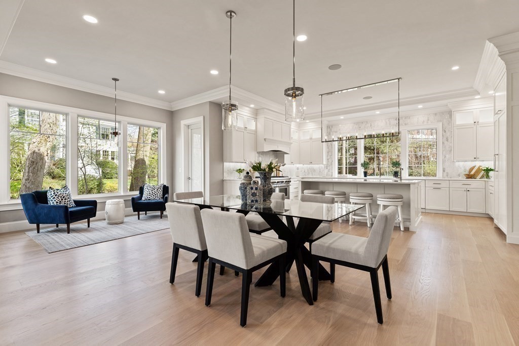 8 Hayes Avenue Lexington, MA 02420 - Photo 7 of 24 a view of a dining room and livingroom with furniture wooden floor a chandelier