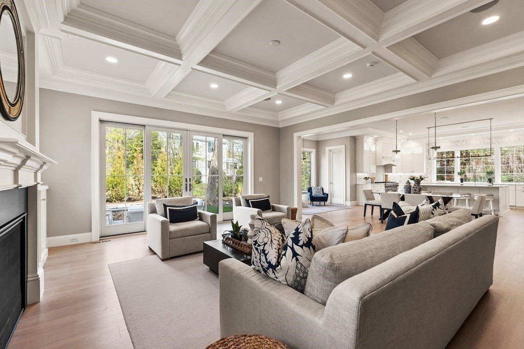 8 Hayes Avenue Lexington, MA 02420 - Photo 8 of 24 a living room with furniture large windows and a fireplace